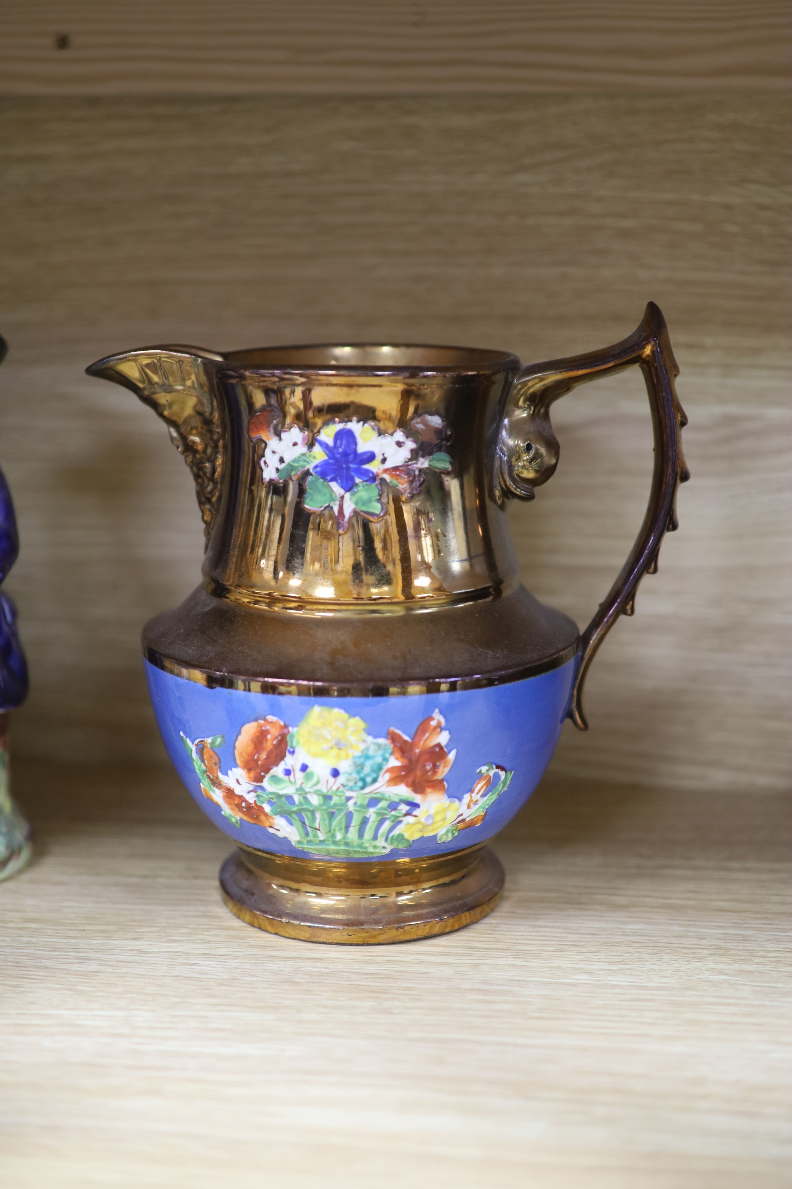 A quantity of Staffordshire pottery, including four Toby jugs, four figures, a copper lustre jug and a silver resist jug (10)